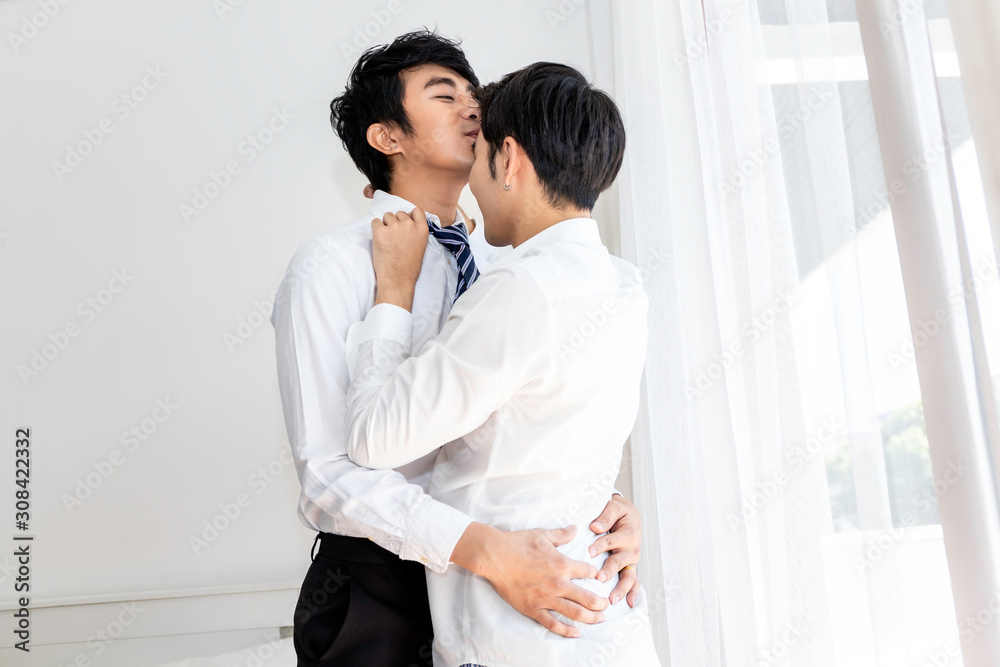 The sweet moment of love.Asian homosexual couple kissing husband before work.Concept LGBT gay.