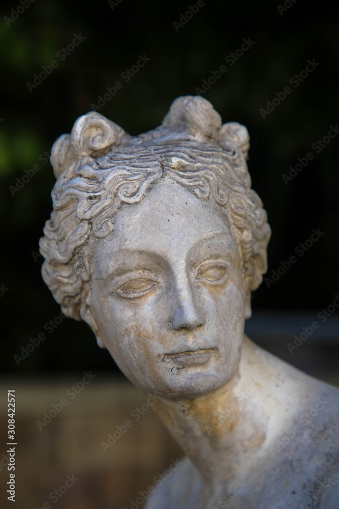 Antique statue of woman on tomb as a symbol of depression and sorrow