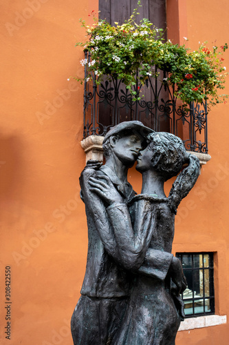  Il Bacio by Severino Morlin. Sculpture of the kissing boy and girl. Bassano del Grappa, Italy. photo