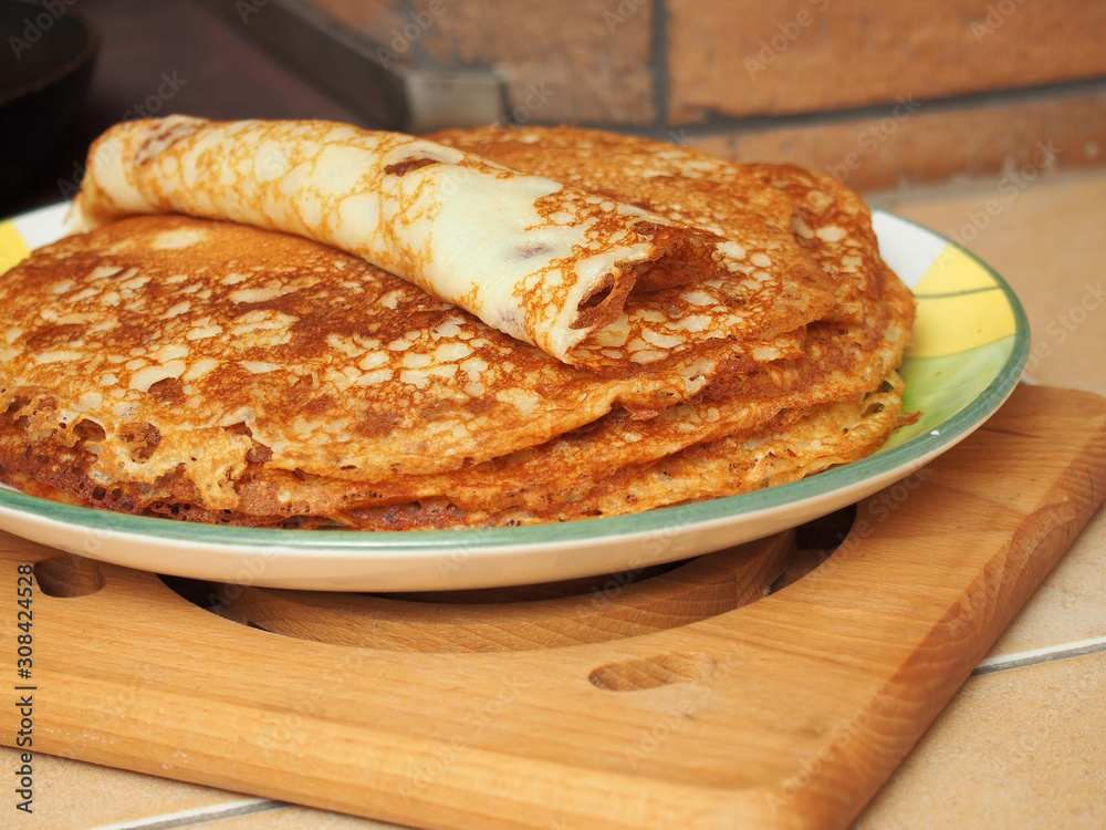 Pancakes are ready to eat. Making yeast pancakes (crepes). Pancakes are ready to eat. Making yeast pancakes (crepes).