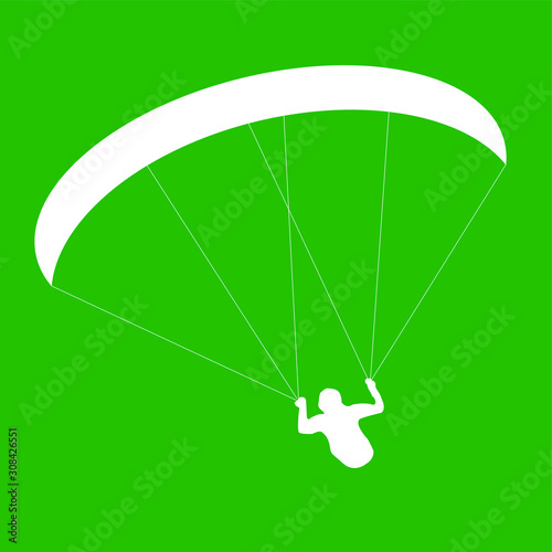 silhouette paraglider or parachutist in flight