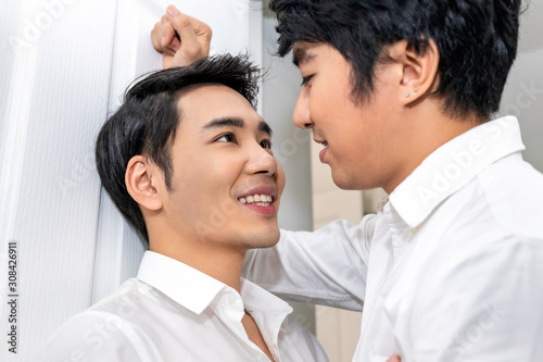 Asian homosexual couple in love looking into each others eyes.Concept LGBT gay.