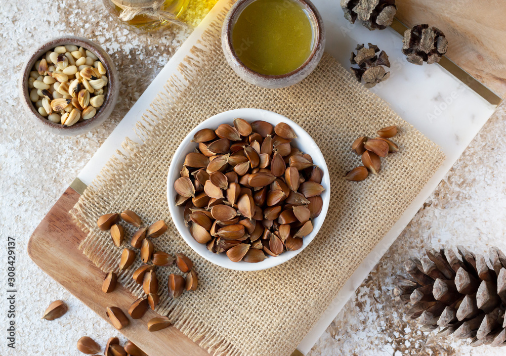 Fototapeta premium Beechnuts and beech nut oil. Healthy organic food concept, vegetarianism. Top view