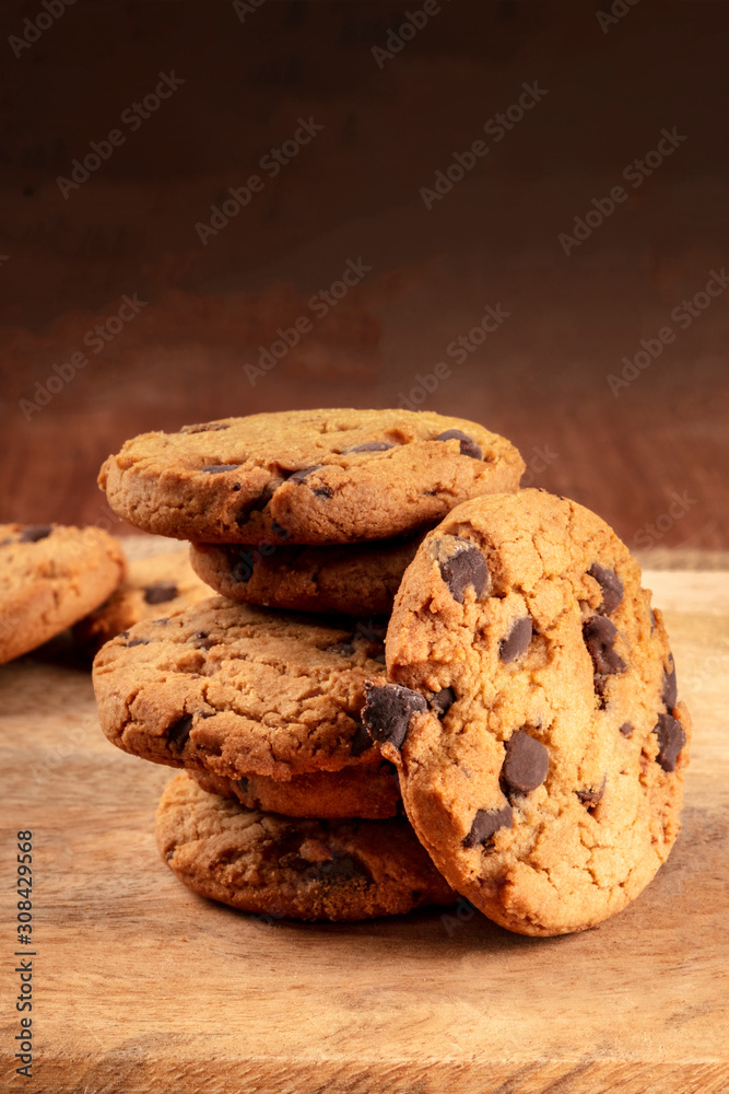 Chocolate chip cookies, gluten-free, a close-up of a stack on a dark rustic background with a place for text Chocolate chip cookies, gluten-free, a close-up of a stack on a dark rustic background with a place for text