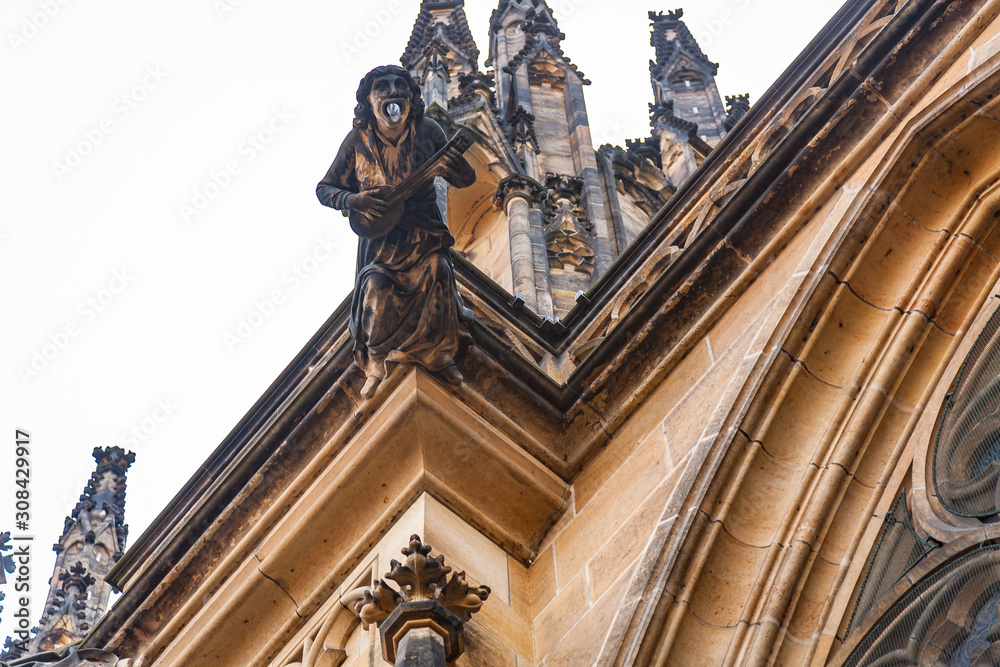 Prague, Prague / Czech Republic: August 22, 2009: Large-scale details of the gargoyles on the facade of the San Vito Cathedral. In 2009 the facade was much cleaner than today, and gargoyles look great