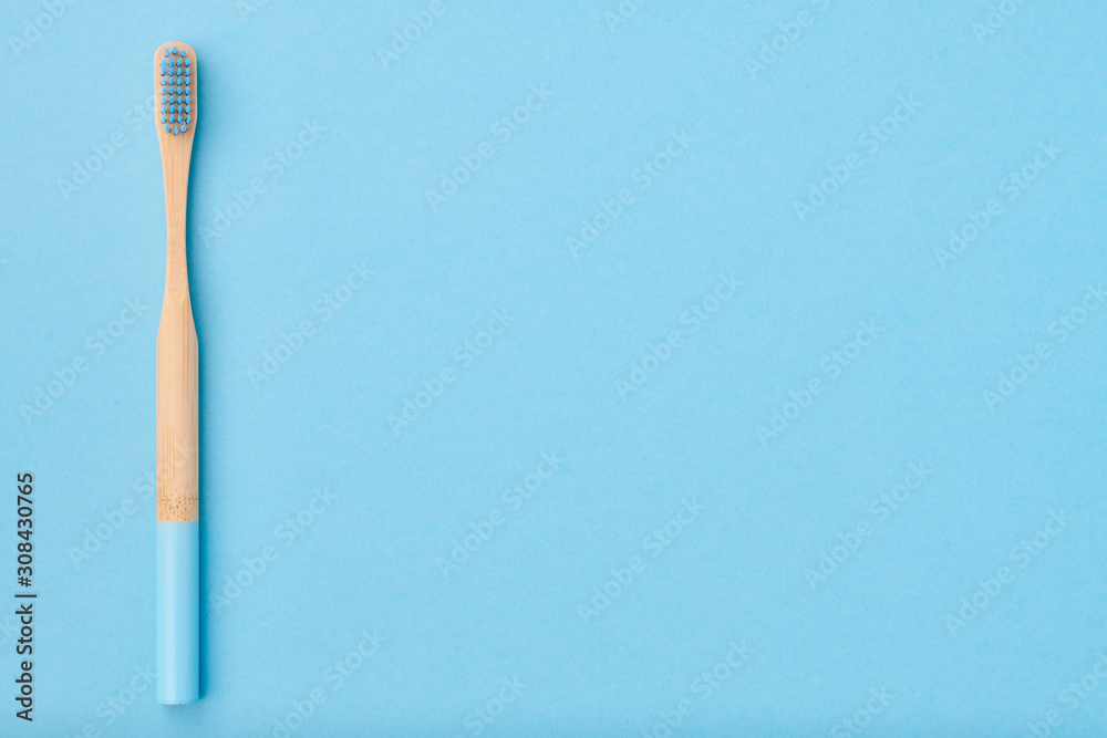 Toothbrush on light blue background top view copy space. Tooth care, dental hygiene and health concept. Toothbrush on light blue background top view copy space. Tooth care, dental hygiene and health concept.