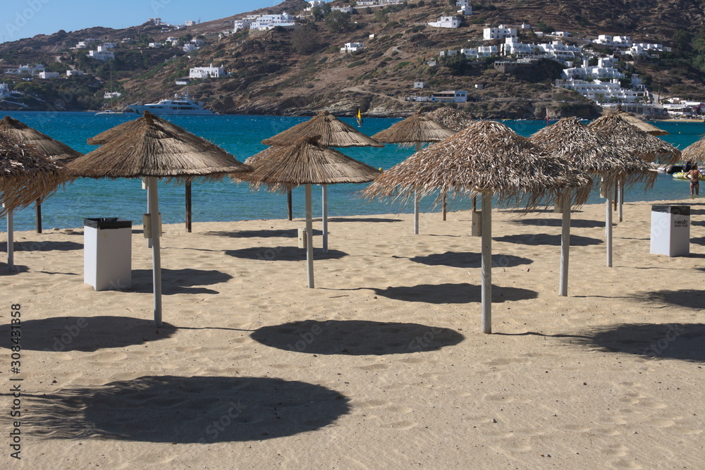 Parasols on a beach on the beautiful Greek island of Ios on a summers day. 
