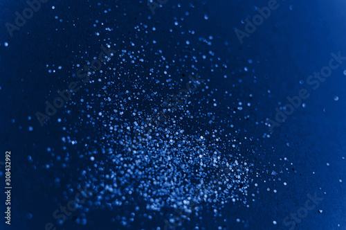 Abstract bokeh background representing the color of the year 2020 classic blue. Toned photo.. Selective focus