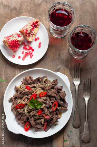 Fried Beef Liver with Onion and Chili Pepper. Turkish Appetizer Ciger Kavurma