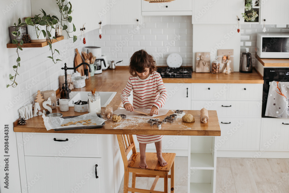 4 years cute girl making traditional Christmas cookies. 4 years cute girl making traditional Christmas cookies.