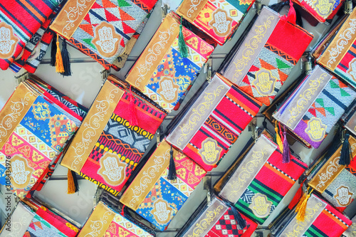 Bags in the shop window with Arabic ornament and pattern of the symbol of the hand of Fatima