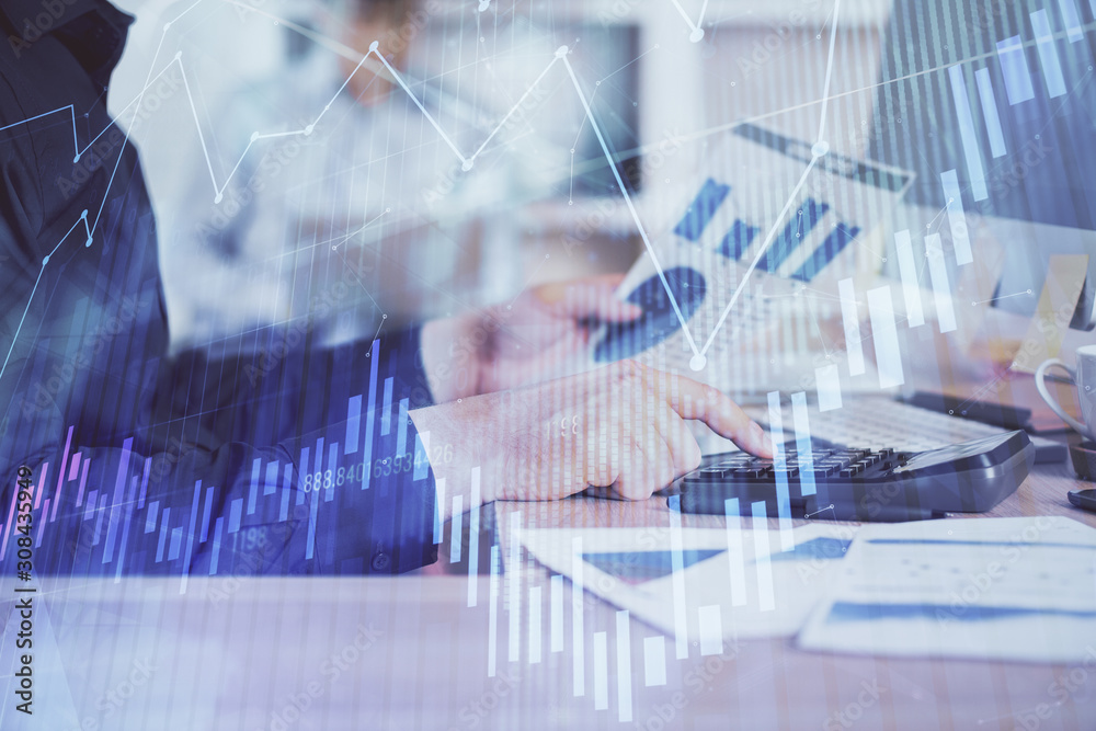 Double exposure of graph with man typing on computer in office on background. Concept of hard work. Closeup. Double exposure of graph with man typing on computer in office on background. Concept of hard work. Closeup.
