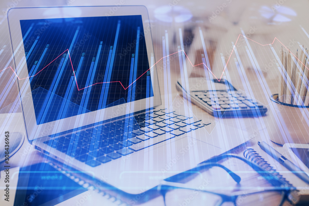 Double exposure of chart and financial info and work space with computer background. Concept of international online trading. Double exposure of chart and financial info and work space with computer background. Concept of international online trading.