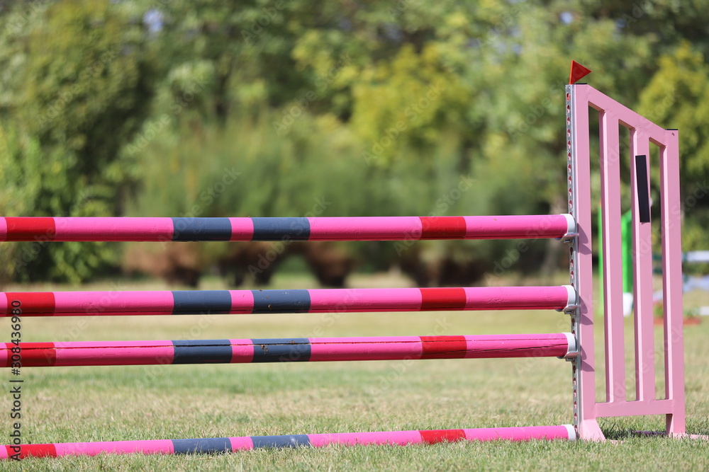 Image of show jumping poles on empty training field. Image of show jumping poles on empty training field.
