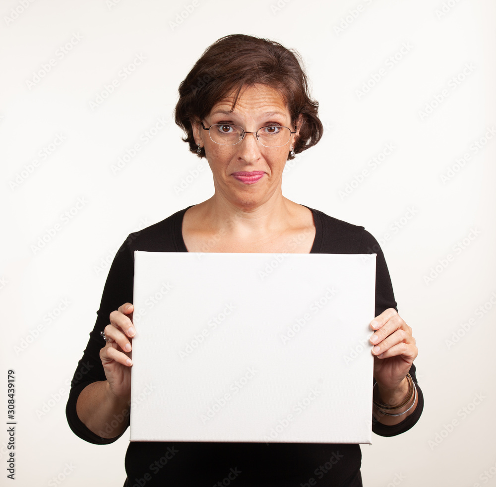 Woman holding up a blank white sign with room for your copy