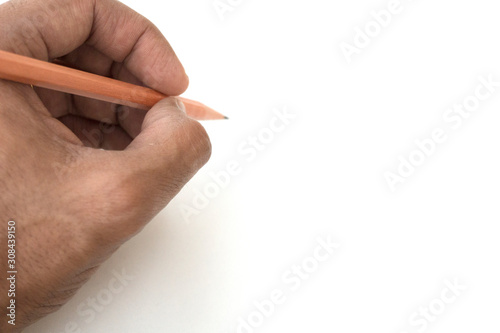 Male hand holding a brown pencil on white background