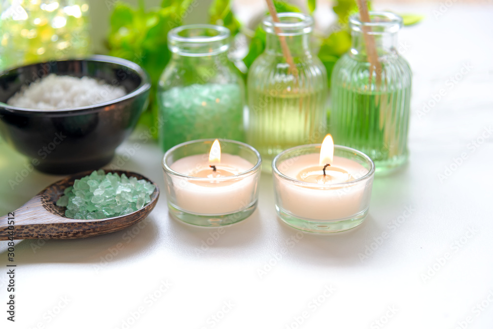 Thai Spa Treatments aroma therapy salt and nature green sugar scrub and rock massage with green orchid flower on wooden white with candle. Thailand. Healthy Concept. Thai Spa Treatments aroma therapy salt and nature green sugar scrub and rock massage with green orchid flower on wooden white with candle. Thailand. Healthy Concept.