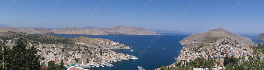 A panoramic view of the port of the Greek island of Symi.  Picture taken at height from the mountains that encircle the bay.