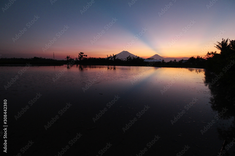 the beauty of the sunset with beauty reflection of mountains in Magelang, Central Java / Indonesia