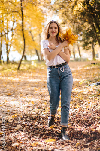 young pretty woman in autumn park