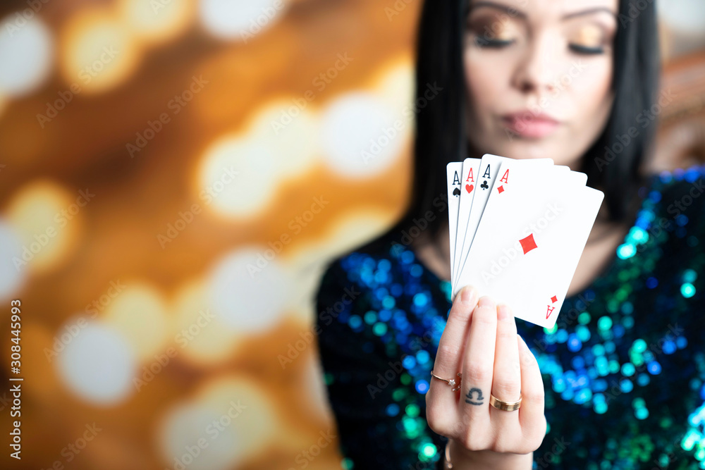 Casino. Portrait of pretty young woman holding playing cadrs in her hand. Casino. Portrait of pretty young woman holding playing cadrs in her hand.