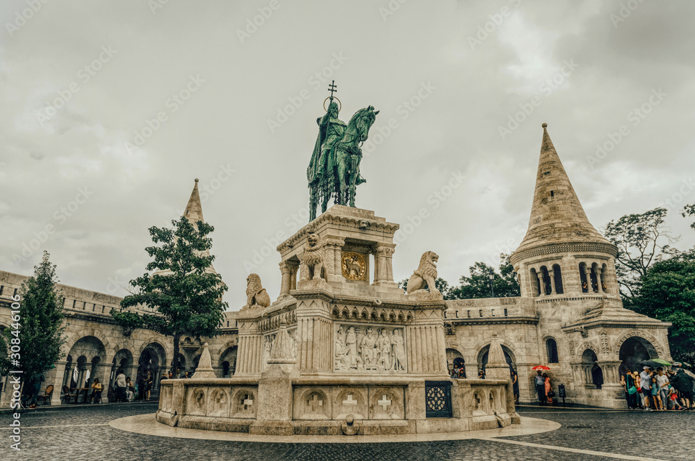Monument to King Matthias against the background of the towers of the Fisherman's Bastion in Budapest