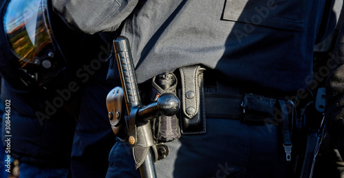 close-up of Baton on the belt of a German policeman in black uniform