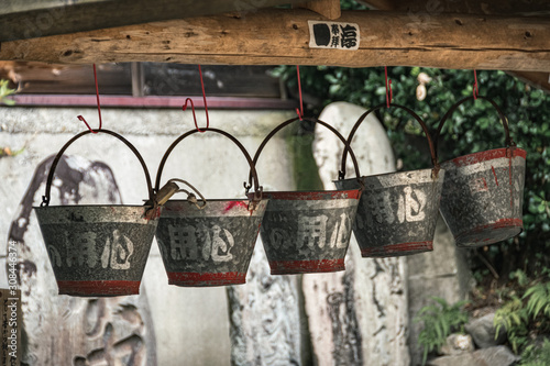 Water buckets hanging above the well in pictoresque village of Narai in Kiso Valley, Japan. photo
