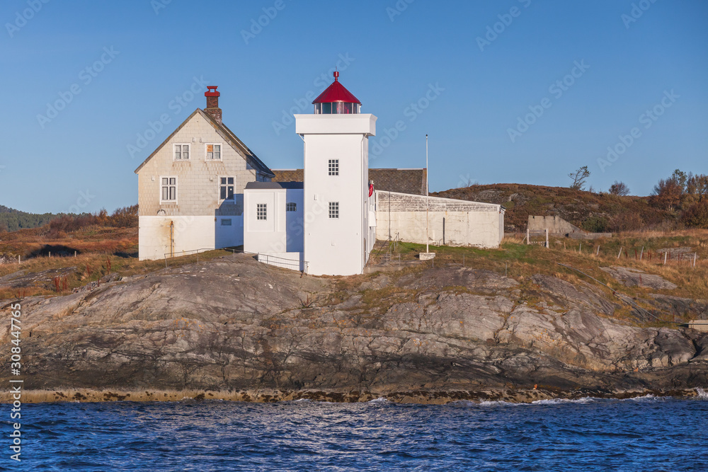 Terningen Lighthouse. White wooden tower with red top