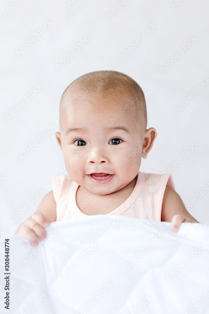 Cute little Asian baby sitting and play with happiness select focus shallow depth of field Cute little Asian baby sitting and play with happiness select focus shallow depth of field