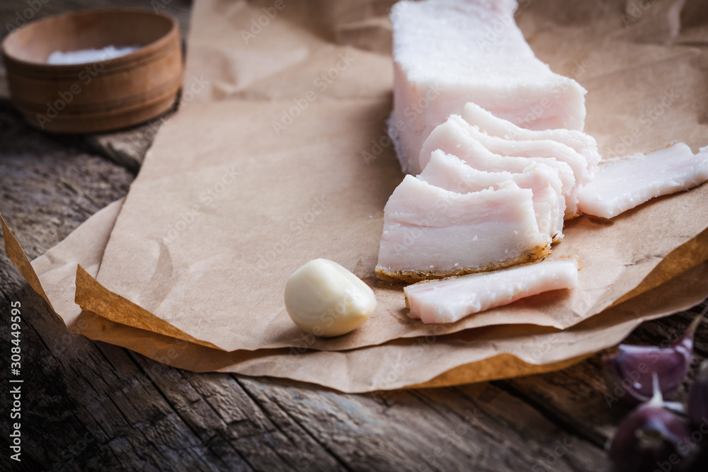 Traditional Ukrainian appetizer, raw lard with garlic and salt Traditional Ukrainian appetizer, raw lard with garlic and salt