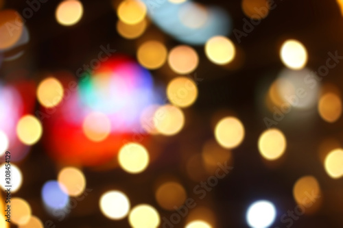 Defocused Christmas background with colorful bokeh lights.
