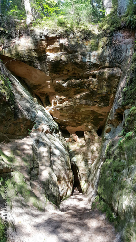 Licu Langu Sandstone Cliffs. The Big Langu Cave. Sand Formations at Lode Behind Cesis in Latvia. photo