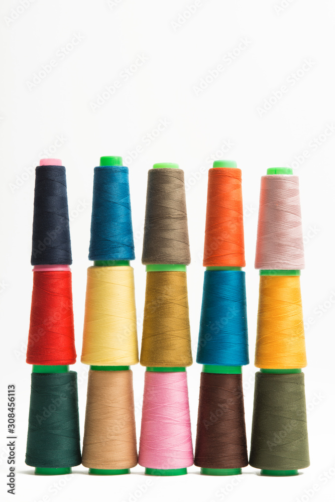 Colorful bobbin thread isolated on white background. Colorful bobbin thread isolated on white background.