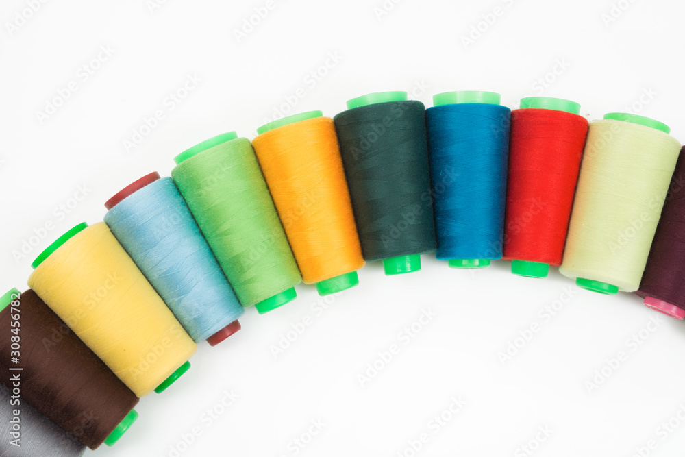 Colorful bobbin thread isolated on white background. Colorful bobbin thread isolated on white background.