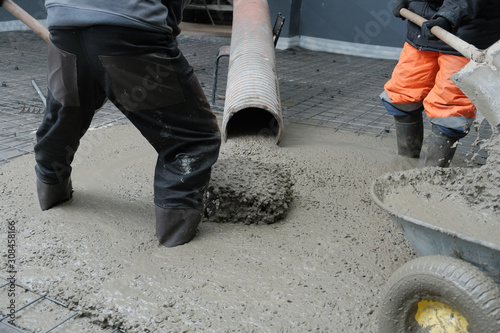 builders poured concrete at the construction site