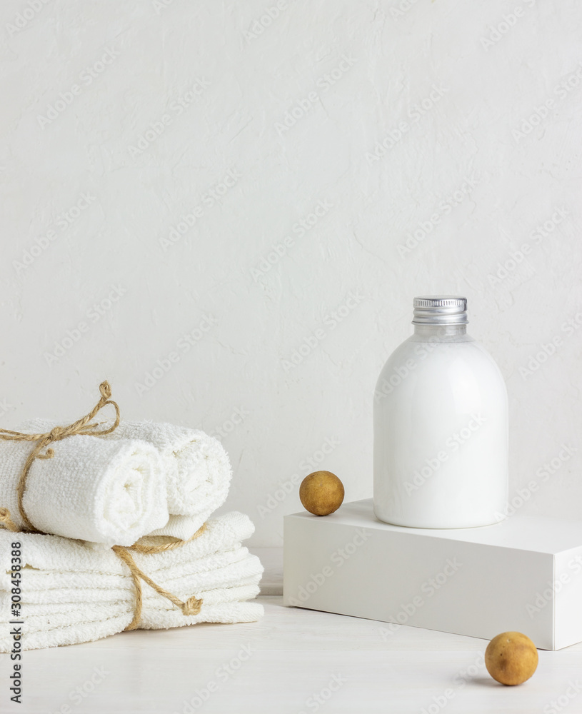 Cosmetics and towels on a white background. Design. Minimal concept.