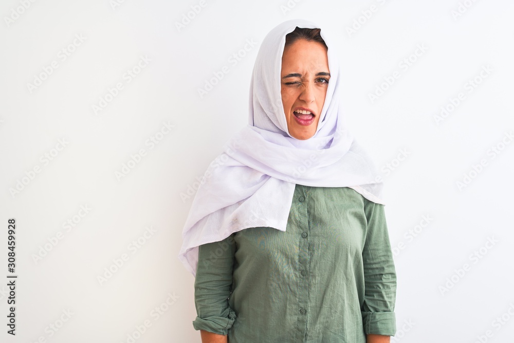 Young beautiful Arab woman wearing traditional Muslim hijab over isolated  background winking looking at the camera with sexy expression, cheerful and  happy face. Stock-Foto | Adobe Stock