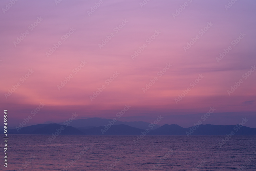 Seascape in delicate pastel colors. Pink dawn over the sea