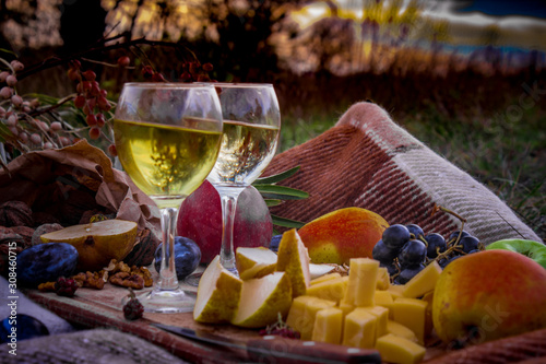 still life with wine in glasses, picnic concept, reflection in glasses