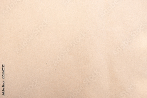 Old texture brown yellow style vintage cardboard sheet of empty paper background.