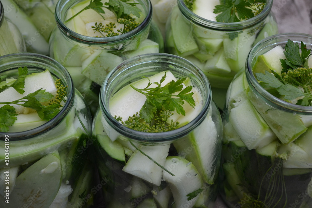 Homemade food. Pepper, parsley. Natural products from the garden. Village, cottage, farm, cellar. Tasty, healthy. Marinated Cucumbers and zucchini Homemade food. Pepper, parsley. Natural products from the garden. Village, cottage, farm, cellar. Tasty, healthy. Marinated Cucumbers and zucchini