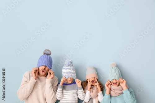 Happy family in winter clot...