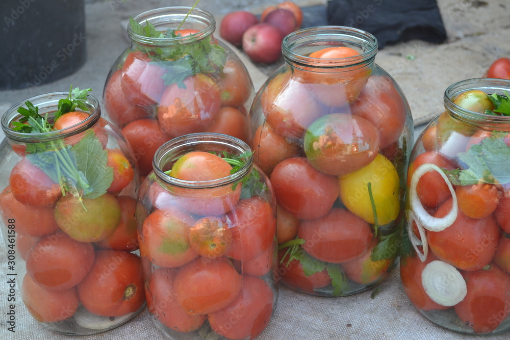 Homemade food. Natural products from the garden. Village, cottage, farm, cellar. Tasty. Preservation. Blanks for the winter. Marinated. Red and yellow tomatoes in jars. Pepper. Spice Homemade food. Natural products from the garden. Village, cottage, farm, cellar. Tasty. Preservation. Blanks for the winter. Marinated. Red and yellow tomatoes in jars. Pepper. Spice