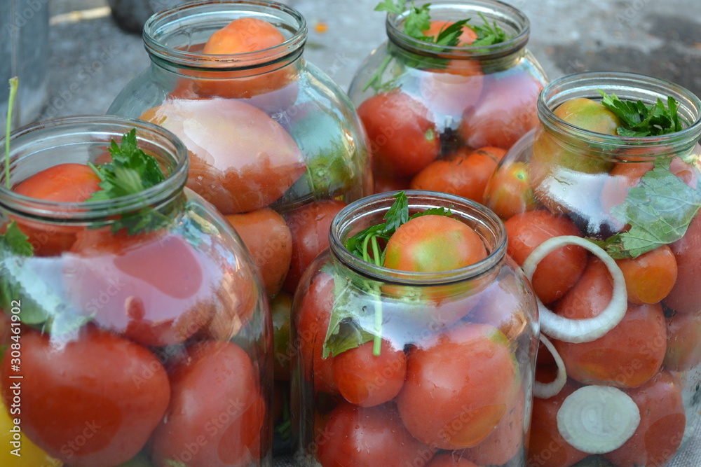 Homemade food. Natural products from the garden. Village, cottage. Blanks for the winter. Marinated. Red and yellow tomatoes in jars. Pepper. Spice Homemade food. Natural products from the garden. Village, cottage. Blanks for the winter. Marinated. Red and yellow tomatoes in jars. Pepper. Spice