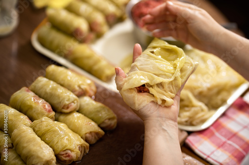 Cabbage rolls filled with minced meat and rice in bowl, sarma photo