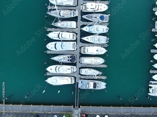 Viaduct Basin, Auckland / New Zealand - December 9, 2019: The beautiful scene surrounding the Viaduct harbour, marina bay, Wynyard, St Marys Bay and Westhaven, all of New Zealand’s North Island photo