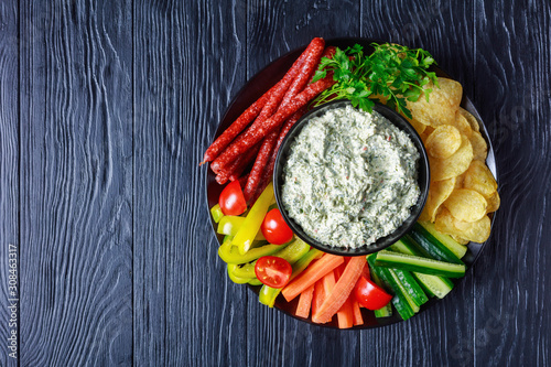 Canvas Print Creamy spinach dip in a black bowl