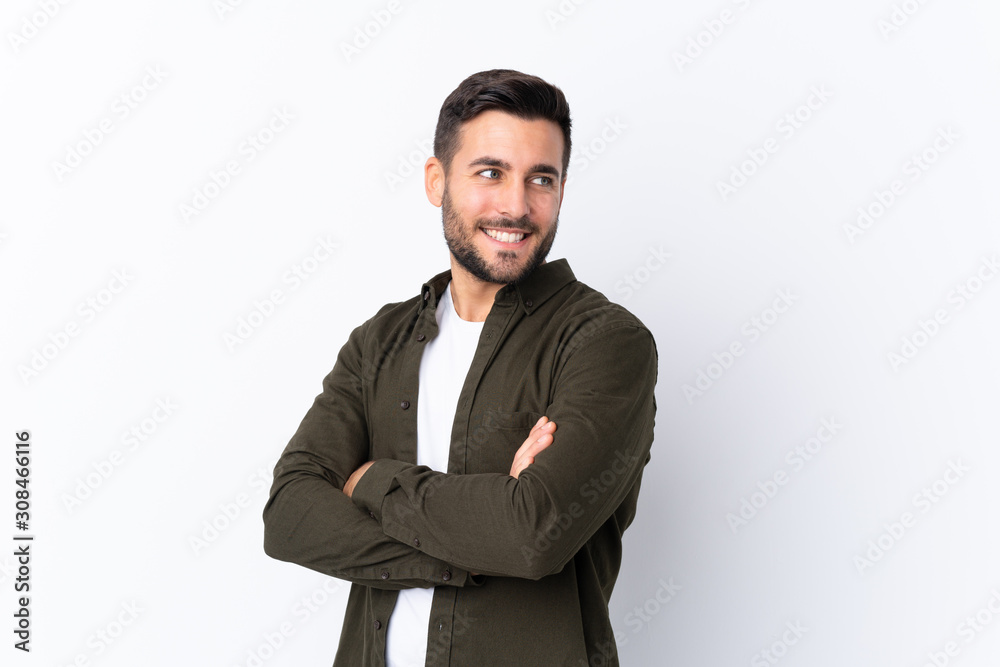 Young handsome man with beard over isolated white background with arms crossed and happy Young handsome man with beard over isolated white background with arms crossed and happy