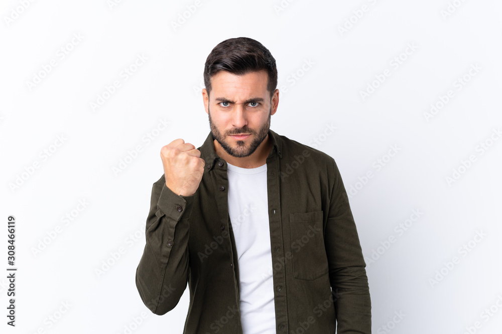 Young handsome man with beard over isolated white background with angry gesture Young handsome man with beard over isolated white background with angry gesture
